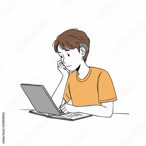 Young boy with hearing aid studying on laptop at home