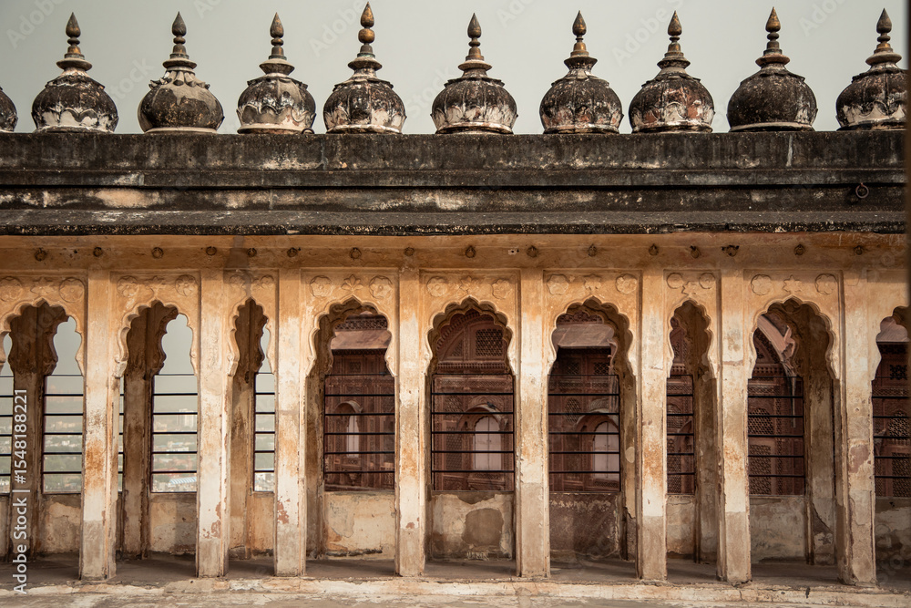 Fototapeta premium Ancient arches and domes adorning rooftop of historic building in Udaipur, India
