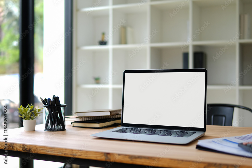 White office desk with laptop and modern office equipment White office desk with laptop and modern office equipment