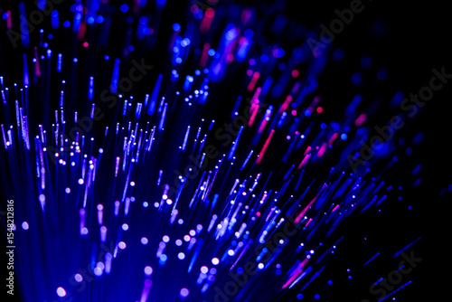 Glowing fiber optic cables in abstract colors