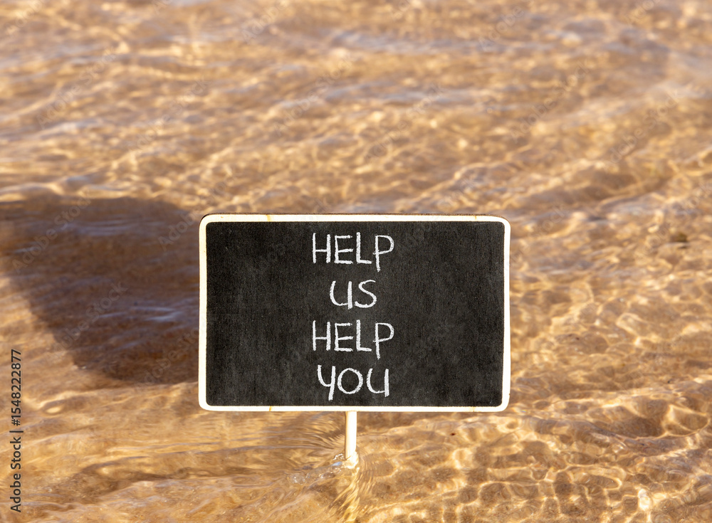 Naklejka premium Help you symbol. Concept words phrase Help us help you on beautiful black blackboard. Beautiful Red sea water background. Business Help you concept. Copy space.