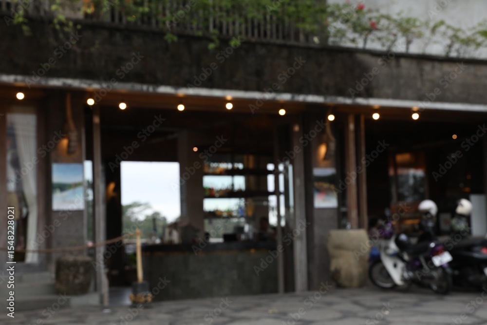 Obraz premium Blurred view of scooters parked near shop