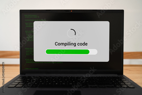 Quadro su tela Compiling code progress bar on laptop screen