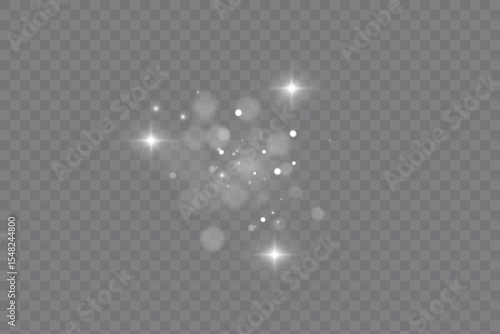 Dust sparks and stars shine with a special light. Christmas light effect. Glittering particles of magic dust.Vector sparkles on a transparent background.