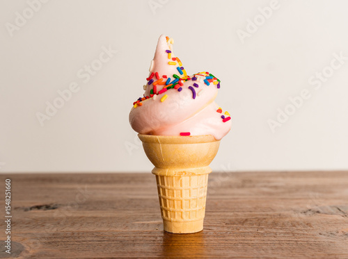 Soft serve ice cream cone with sprinkles