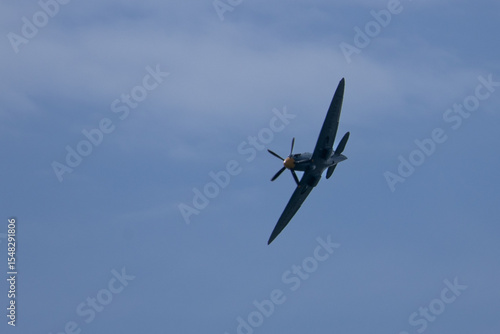 Spitfire plane in flight on sunny day. High quality photo