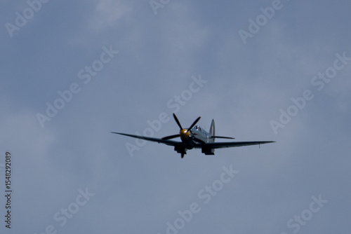 Fotografie Spitfire plane in flight on sunny day. High quality photo