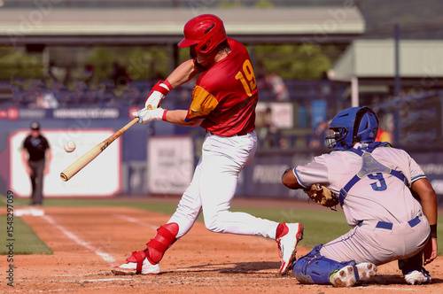 baseball player #19 making contact