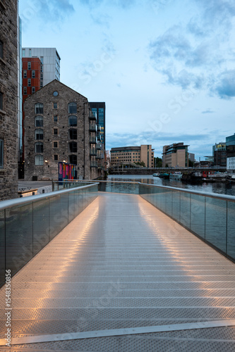 Canvas Print Dublin, Ireland - June 6 2025 Architecture during the golden our at Dockland's