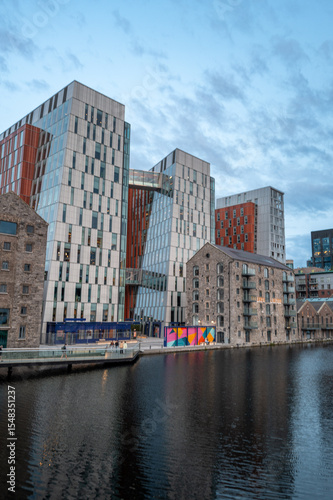 Canvas Print Dublin, Ireland - June 6 2025 Architecture during the golden our at Dockland's