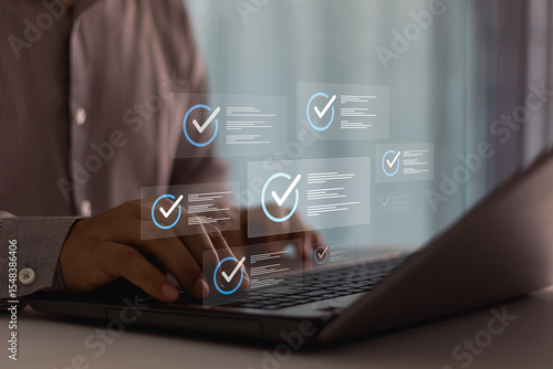 Fotografija Businessman typing on laptop