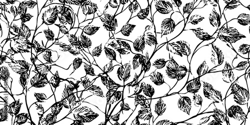 Seamless twisting vine tendrils pattern in black and white for decorative design
