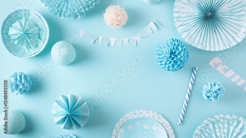 A blue background with a lot of blue decorations including paper flowers
