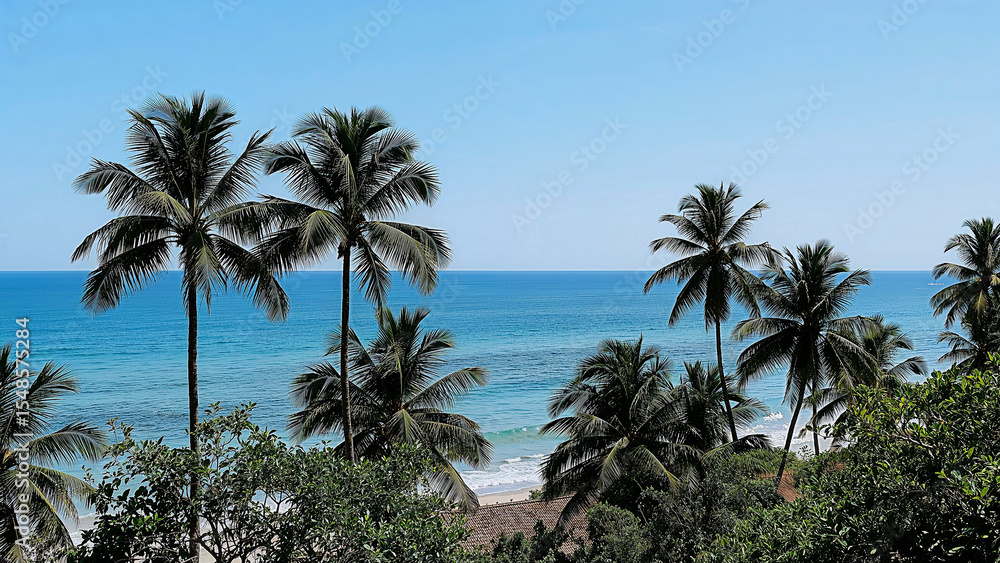 Fototapeta premium Serene beachfront oasis with ocean and palm trees