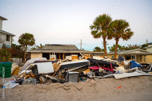 Hurricane damage in Florida. Piles of rubbish on street side from destroyed houses. Consequences of natural disaster