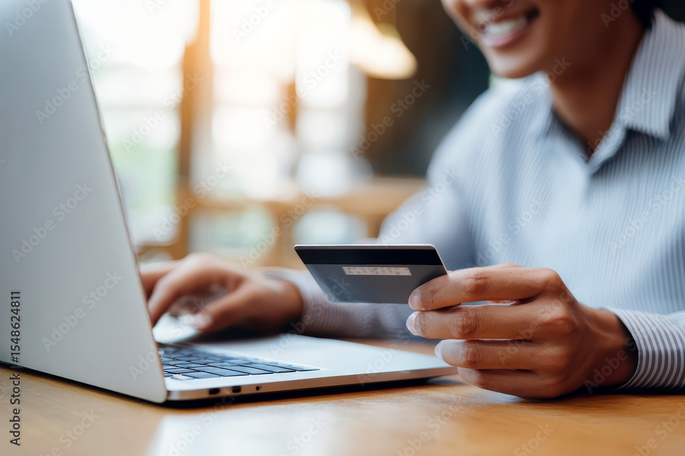 woman makes a purchase on the Internet on the computer with credit card. woman makes a purchase on the Internet on the computer with credit card.