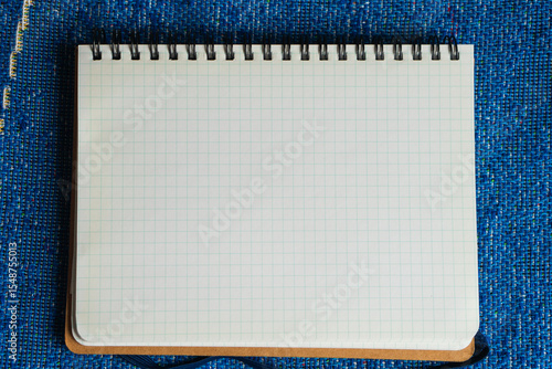 方眼紙のノート　薄い水色のグリッド入りのシンプルな背景素材