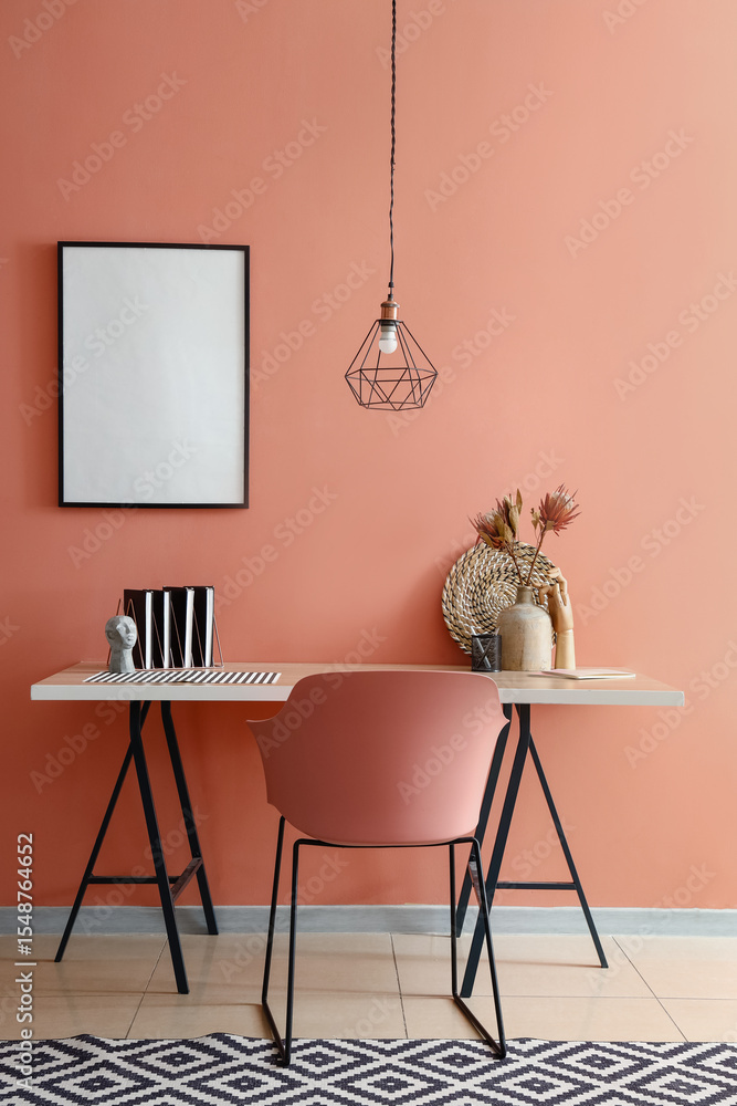 © Pixel-Shot - Stylish interior of room with workplace and blank poster hanging on color wall © Pixel-Shot - Stylish interior of room with workplace and blank poster hanging on color wall