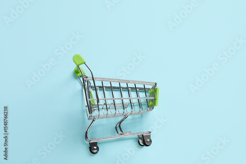 Shopping cart on blue backg...