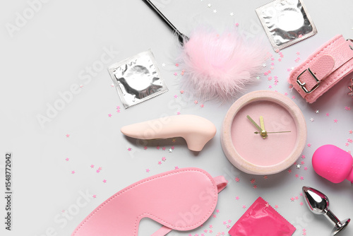 Alarm clock with sex toys a...