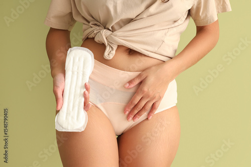 Young woman in beige menstr...