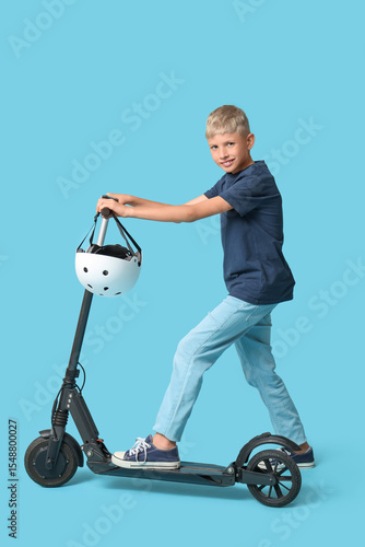 Cute boy with modern electr...