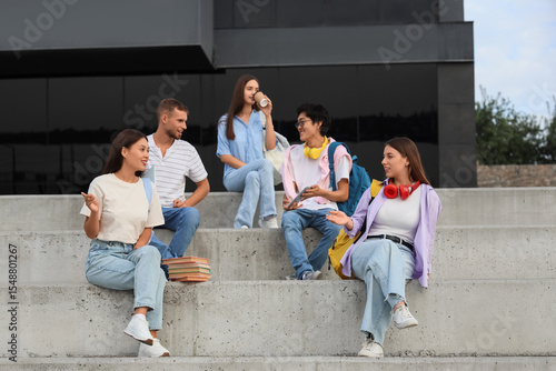 Group of young students sit...