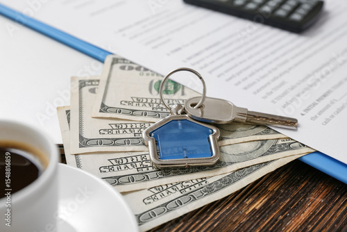 Key with money and house re...
