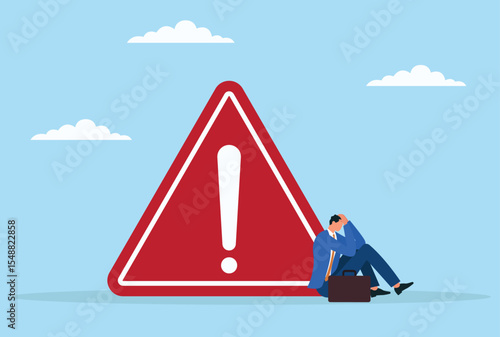 Vector illustration of a frustrated businessman sitting beneath a huge warning icon, representing the overwhelming pressure and stress caused by looming risks and business challenges
