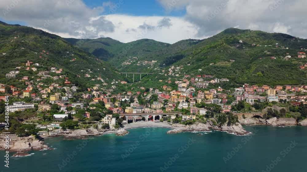 A picturesque italian coastal town nestled between lush green hills and the mediterranean sea, aerial view A picturesque italian coastal town nestled between lush green hills and the mediterranean sea, aerial view