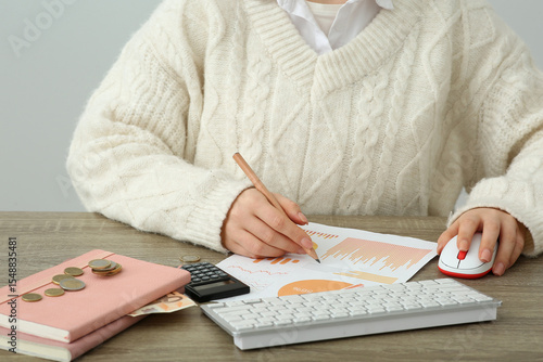 Woman with diagrams using c...
