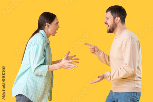 Angry young couple quarreli...