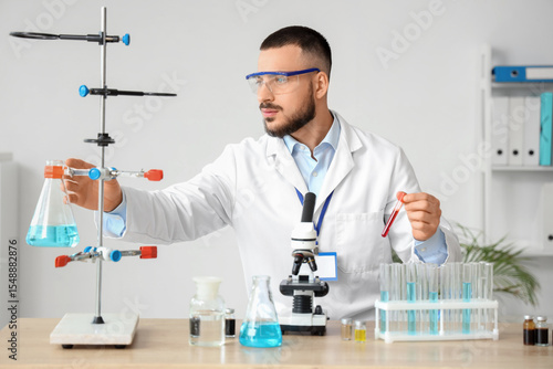 Male scientist with glasswa...