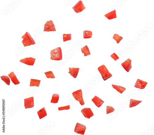 A collection of small, diced red pieces resembling chopped tomatoes, arranged randomly on a white background.
