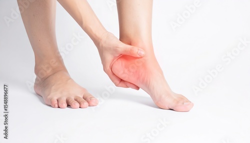 Tired woman massages her sore foot, heel aching from office syndrome and poor posture.