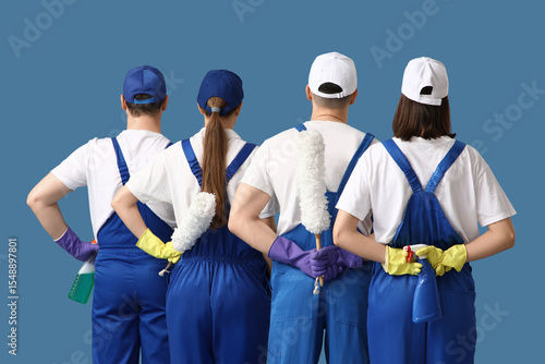 Team of young janitors with...