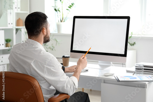 Young businessman working w...