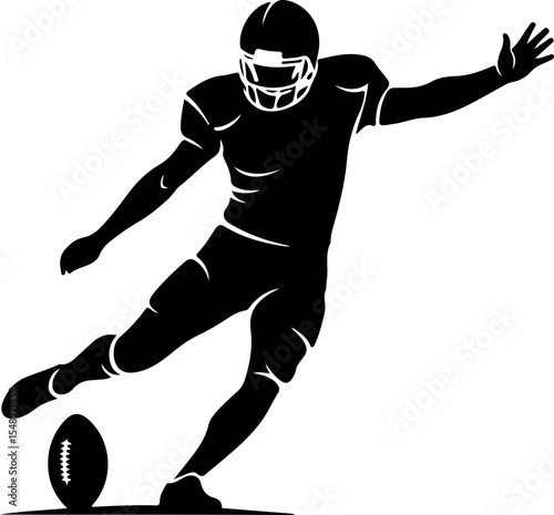 Silhouetted American Football Player Kicking the Ball