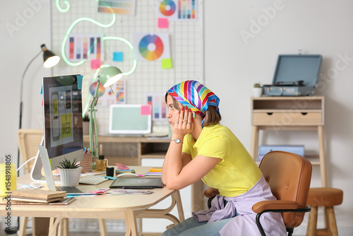 Tired female web designer s...