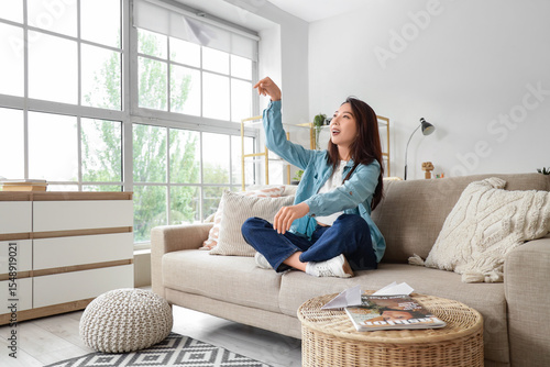 Young Asian woman throwing ...