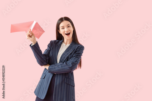 Young businesswoman with pa...