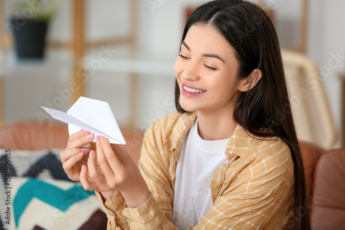 Young woman with paper plan...