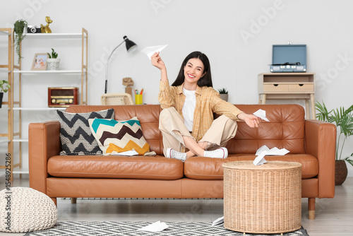 Young woman with paper plan...