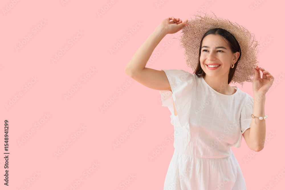 Stylish young woman in summer hat on pink background Stylish young woman in summer hat on pink background