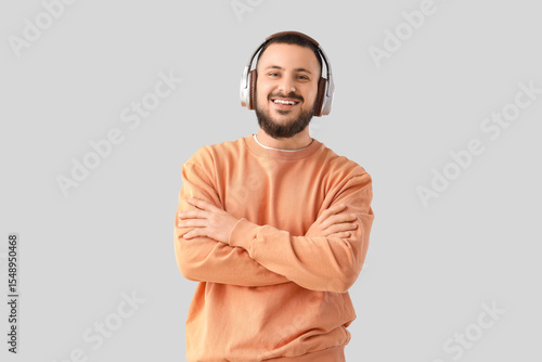 Young man in headphones wit...