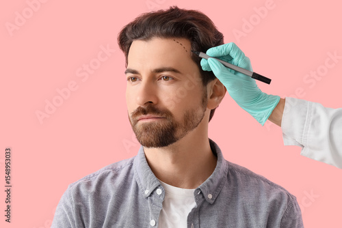 Doctor applying marking on ...