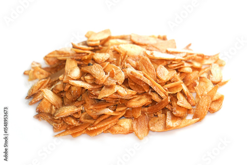 Billede på lærred Allium Sativum, fried garlic, thinly sliced golden yellow frame For decorating f