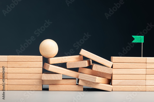 Fotografía The ball balances on unstable blocks, symbolizing effort and persistence through