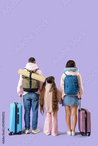 Family with luggage and bac...