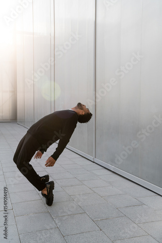 Man leaning back with glare around him